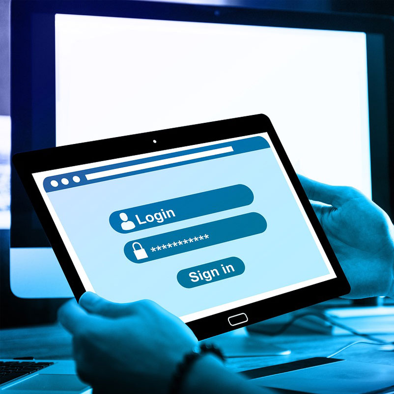 Sign_in_01 Photograph of a pair of hands holding an ipad which shows a large full screen login and password area with Sign In button below it.