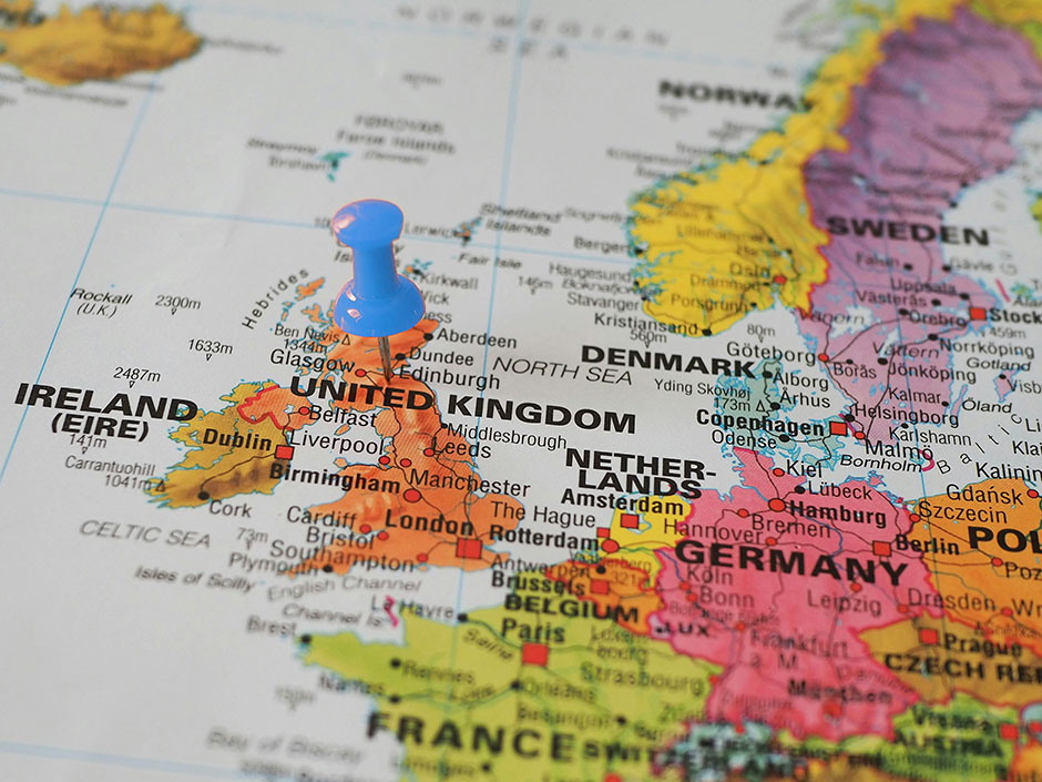 Coloured map of europe with blue pin situated just under Edinburgh.